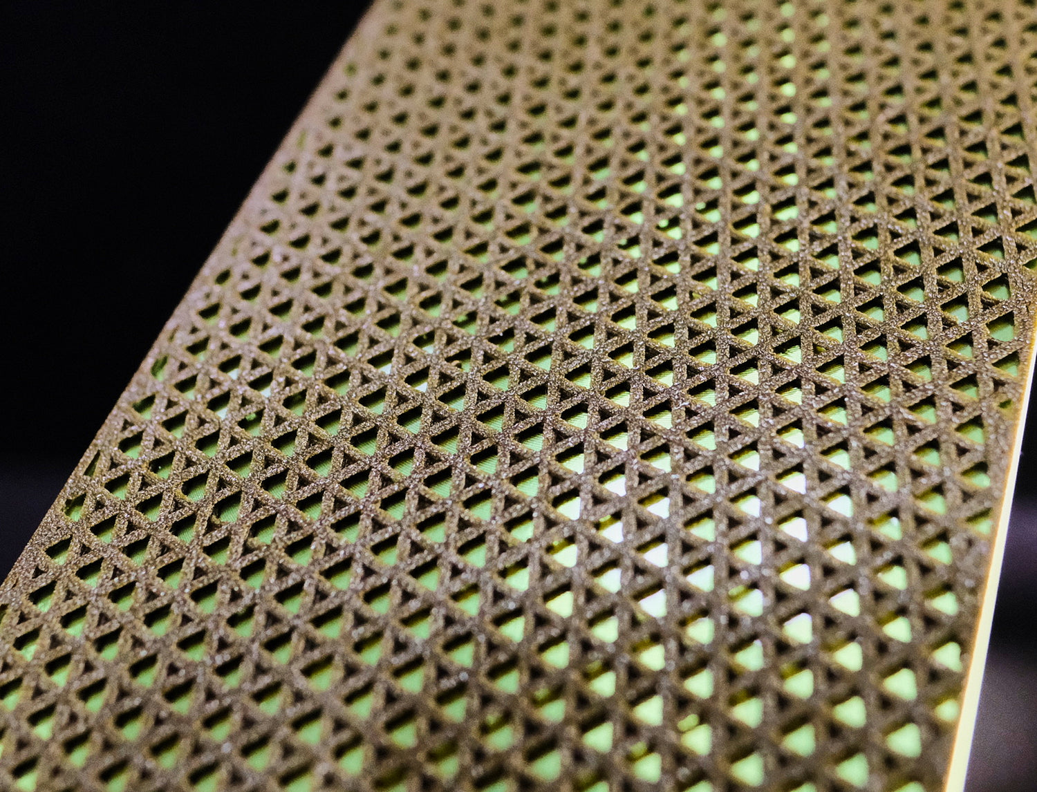 Close up of the surface of a diamond ceramic plate for knife sharpening with triangular surface pattern